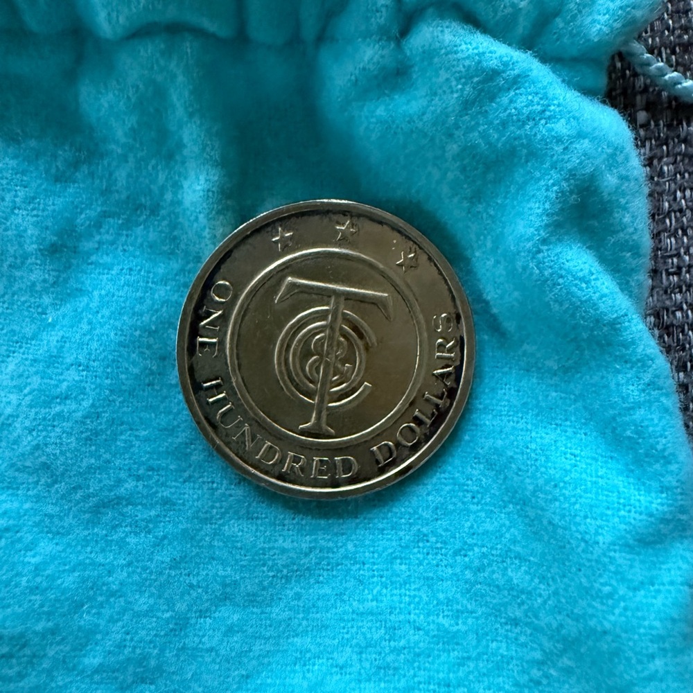 Tiffany & Co. Silver Coin with Blue Cloth pouch